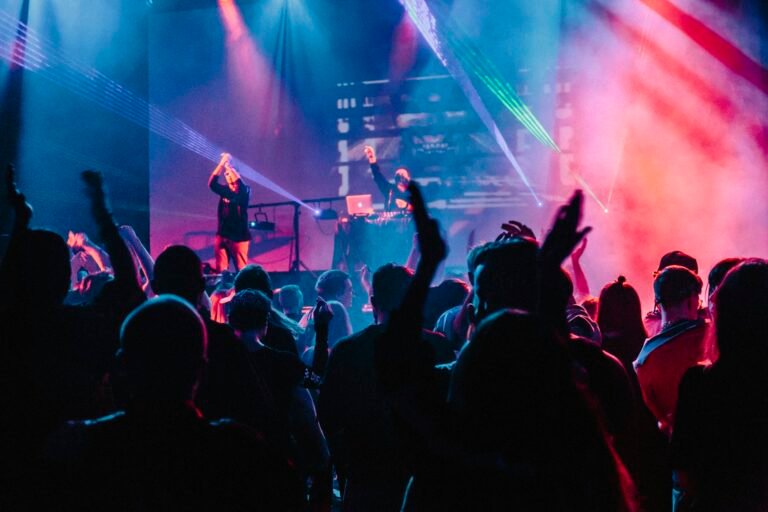 Crowd with raised hands at a corporate party
