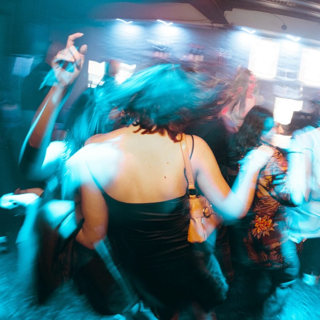 Dancing guests at a DFW party with 360 video booth